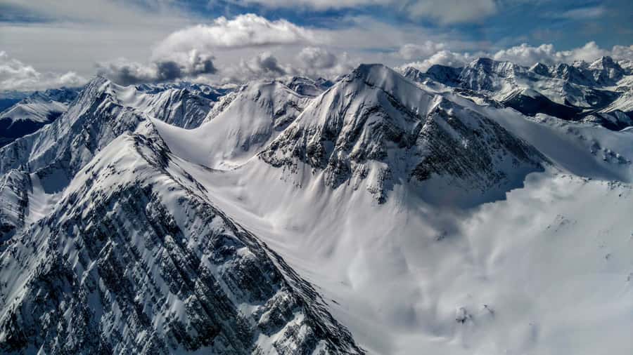 Canmore: 25-Minute Three Sisters Helicopter Tour - From a log building in Canmore to the Bow River