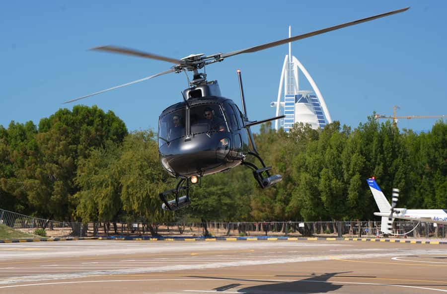 Dubai: Helicopter Ride, Old Town Walking Tour, Abra & Snacks - Timing, clothing, and practical details