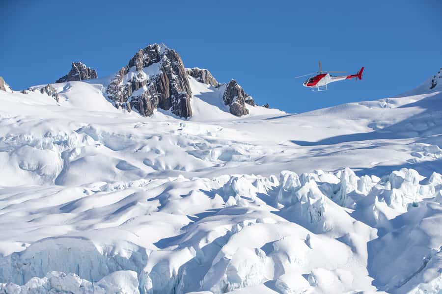 Franz Josef & Fox Glaciers Helicopter Flight & Snow Landing - Taking off from Franz Josef township