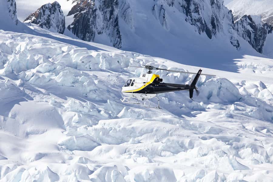 Franz Josef: Glacier Helicopter Ride with Snow Landing - Leaving Franz Josef and rising into the Southern Alps
