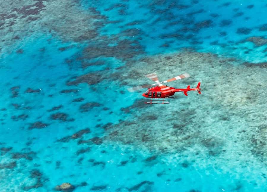 Port Douglas: Great Barrier Reef 30-Minute Helicopter Flight - Taking off above Port Douglas and 4 Mile Beach