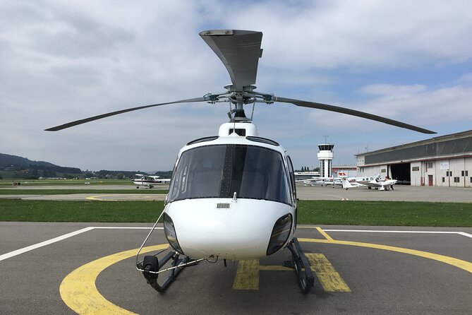Private helicopter flight to Stockhorn mountain, with view to the Swiss Alps - Lake Thun’s changing blue colors