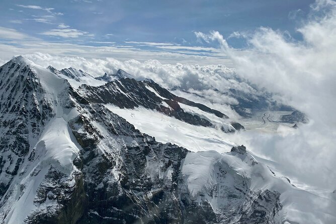 Private Swiss Alps helicopter tour over snow covered mountain peaks and glaciers - The Eiger north face and Grindelwald Valley