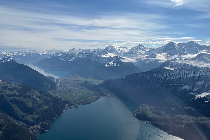 Private Swiss Alps helicopter tour over snow covered mountain peaks and glaciers - A private flight makes the high price easier to assess