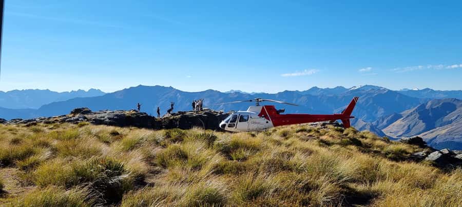 Queenstown: Scenic Alpine Heli-Flight - Stepping onto a remote alpine peak