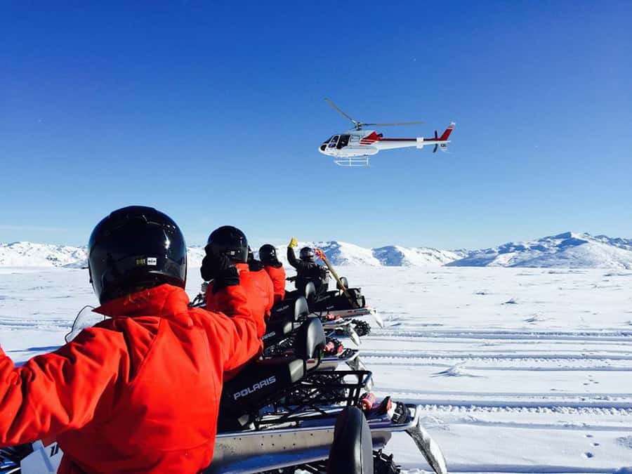 Queenstown: Snowmobiling Experience with Helicopter Flight - Riding your own snowmobile in the Garvie Mountains