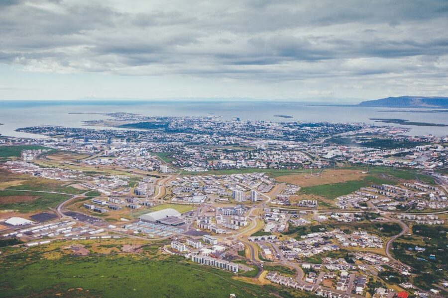 Reykjavik: Panoramic Helicopter Flight with Summit Landing - Reykjavik from the air: Harpa, Hallgríms Church, and bright rooftops